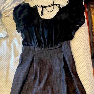 Black dress, the top has more room and it’s tight around the waist